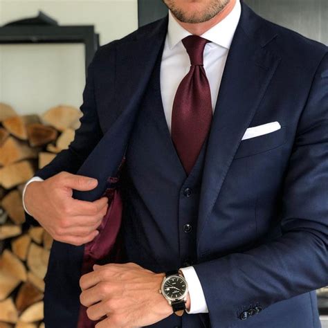 navy suit maroon tie.